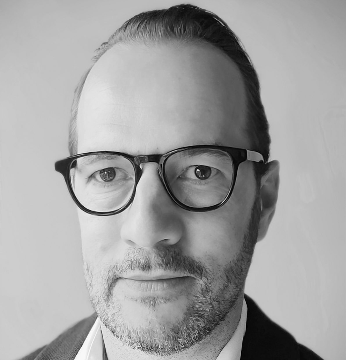 A headshot of Pieter Verdegem in black and white.